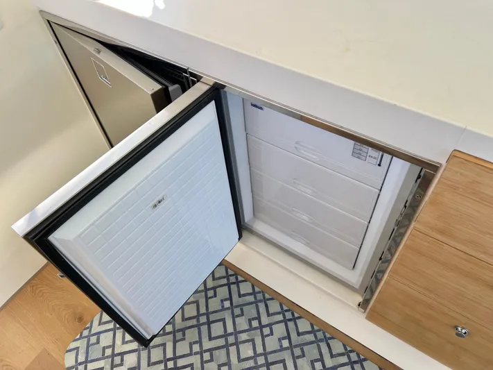 Windsurfer Yacht Photos Pics Built-in refrigerator on Custom Max Cruise 44SC yacht, 2022 model, with open door and modern design.