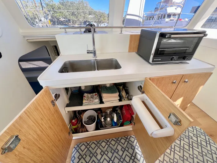 Windsurfer Yacht Photos Pics Modern kitchen in 2022 Custom Max Cruise 44SC yacht with sink, oven, and storage.