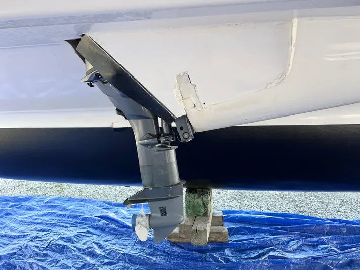 Windsurfer Yacht Photos Pics Max Cruise Marine 44SC 2022 boat hull and propeller detail on blue tarp.