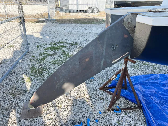 Windsurfer Yacht Photos Pics Max Cruise Marine 44SC 2022 boat keel on gravel, supported by stands.