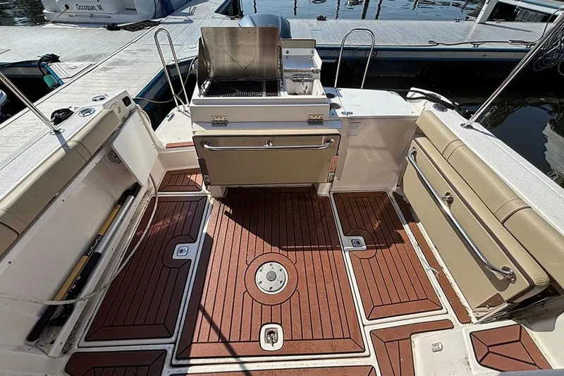  Yacht Photos Pics 2021 Ranger Tugs R-27 boat deck with seating and grill, docked at marina.