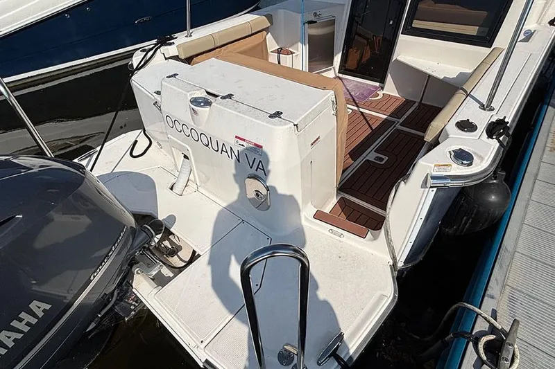  Yacht Photos Pics 2021 Ranger Tugs R-27 boat docked, featuring spacious deck and Yamaha engine.