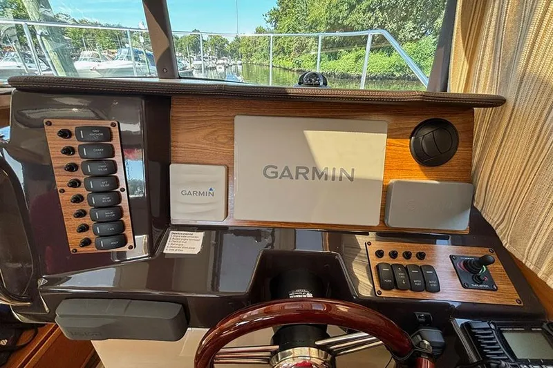  Yacht Photos Pics 2021 Ranger Tugs R-27 helm with Garmin navigation system and control panel.