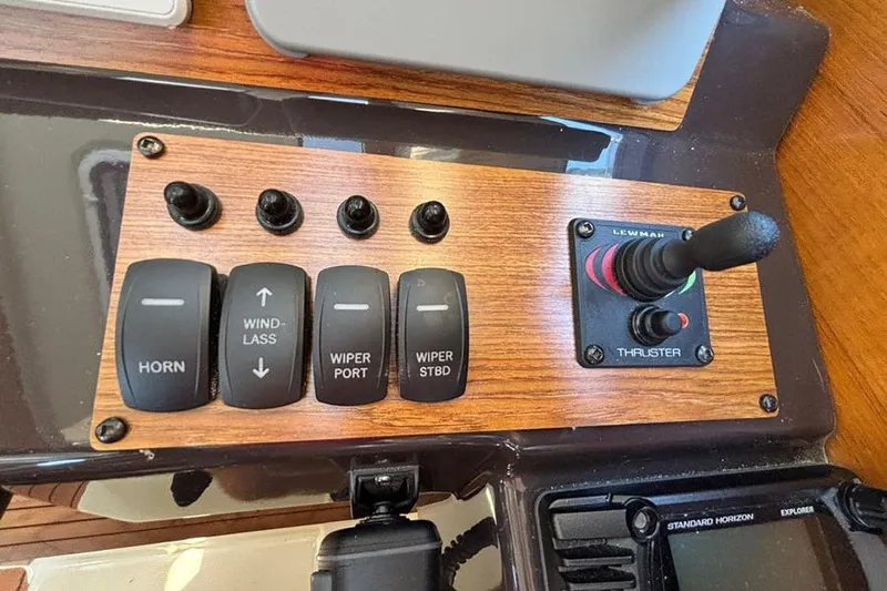  Yacht Photos Pics Control panel of a 2021 Ranger Tugs R-27 boat with switches and thruster joystick.