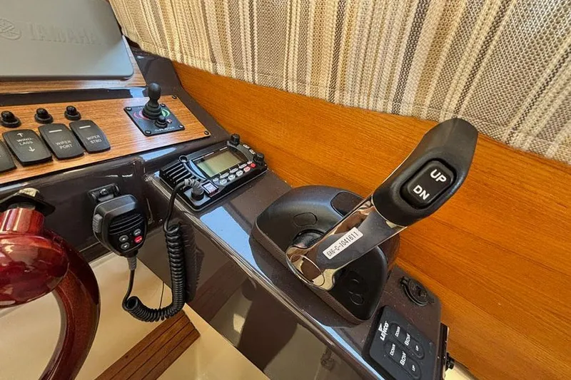  Yacht Photos Pics Control panel of 2021 Ranger Tugs R-27 boat with joystick and radio equipment.