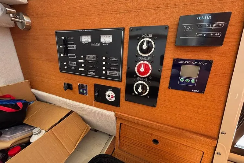  Yacht Photos Pics Control panel of a 2021 Ranger Tugs R-27 boat with various switches and gauges.