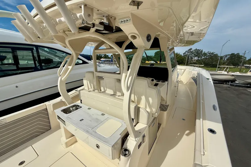  Yacht Photos Pics 2026 Scout 400 LXF Li-Ion boat interior with seating and fishing rod holders.