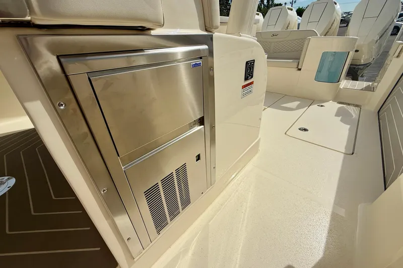  Yacht Photos Pics 2026 Scout 400 LXF Li-Ion boat interior with stainless steel appliance and seating area.