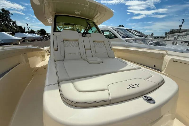  Yacht Photos Pics Luxurious seating on 2026 Scout 400 LXF Li-Ion boat under clear blue sky.