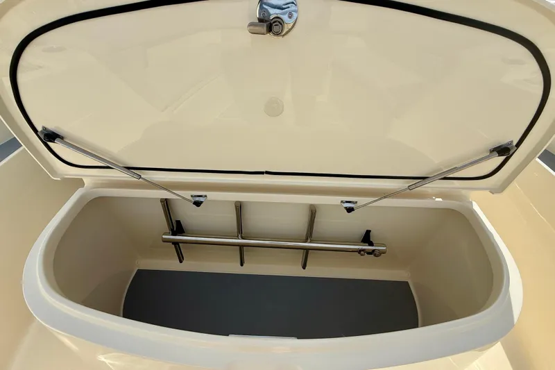  Yacht Photos Pics Open storage compartment of 2026 Scout 400 LXF Li-Ion boat, showcasing interior space.