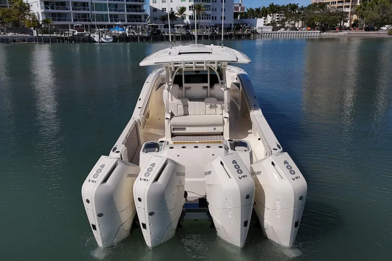 Yacht Photos Pics 2026 Scout 400 LXF Li-Ion boat with quad Mercury 400 engines on calm water.