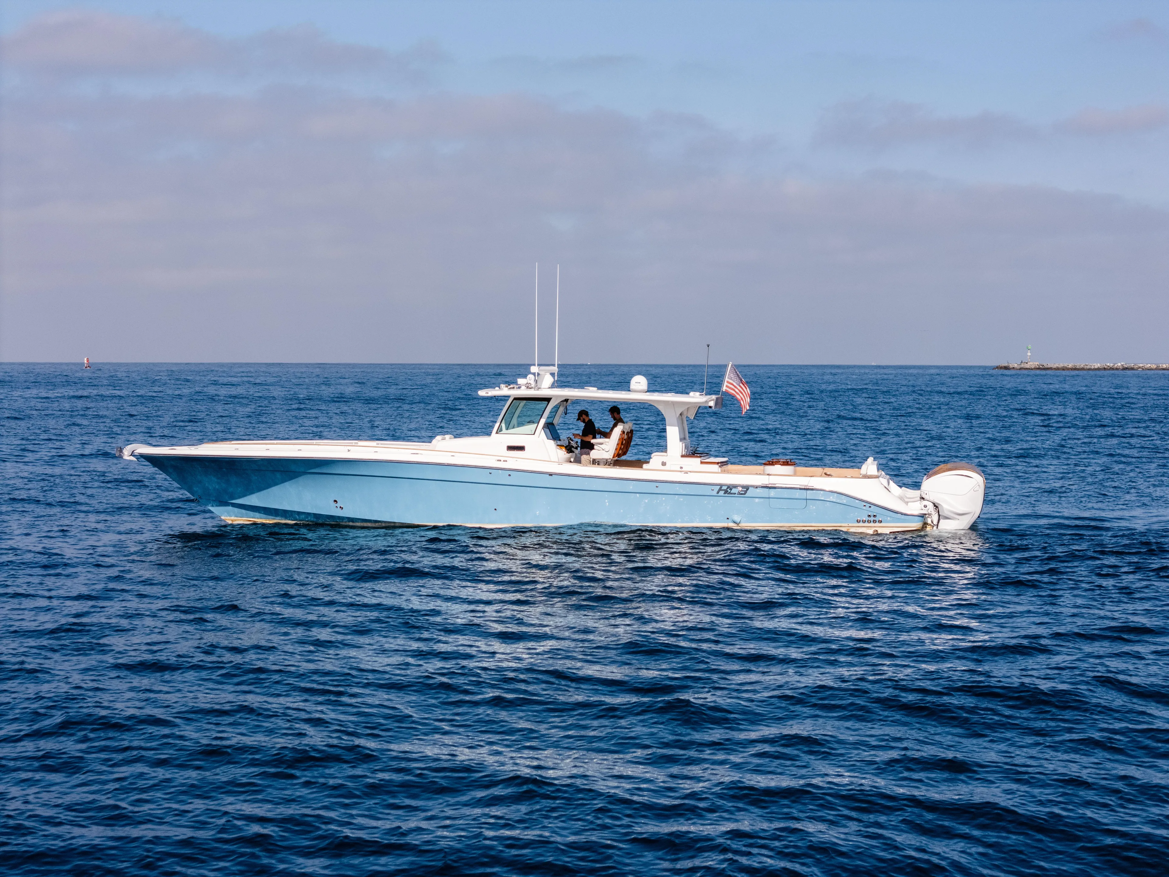  Yacht Photos Pics 2020 HCB 53 Sueños boat cruising on open water under a clear sky.
