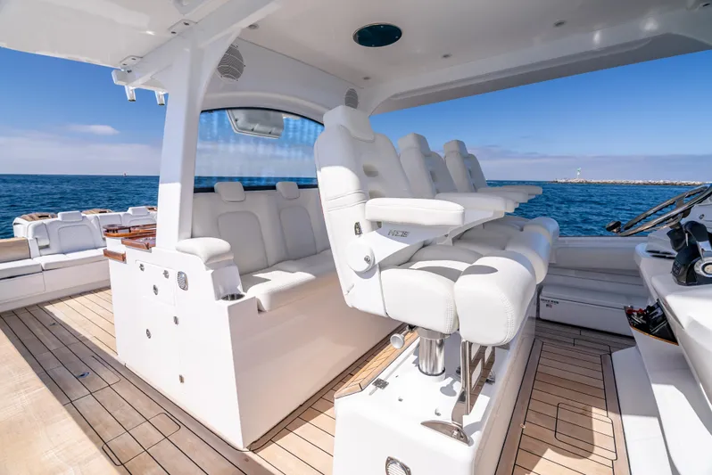  Yacht Photos Pics Luxurious 2020 HCB 53 Sueños yacht interior with white seating and ocean view.