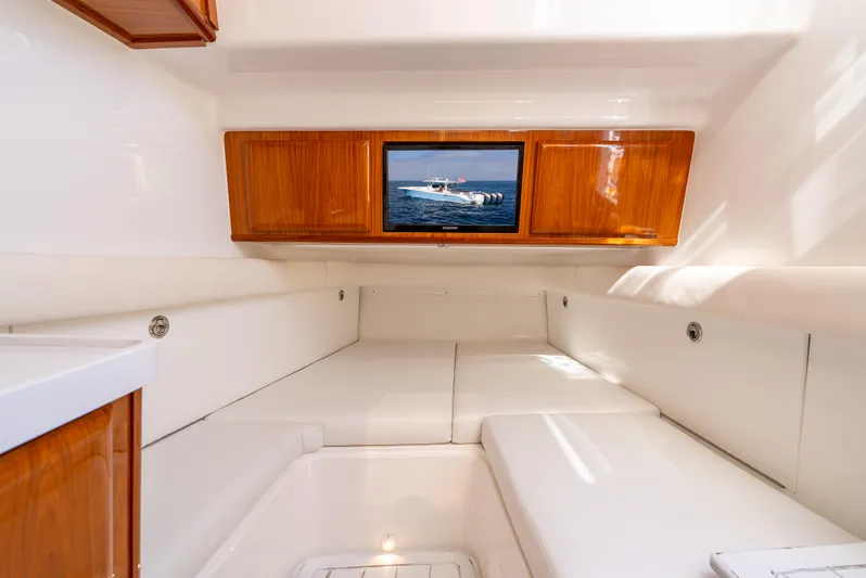  Yacht Photos Pics Luxurious interior cabin of 2020 HCB 53 Sueños boat with wooden accents.