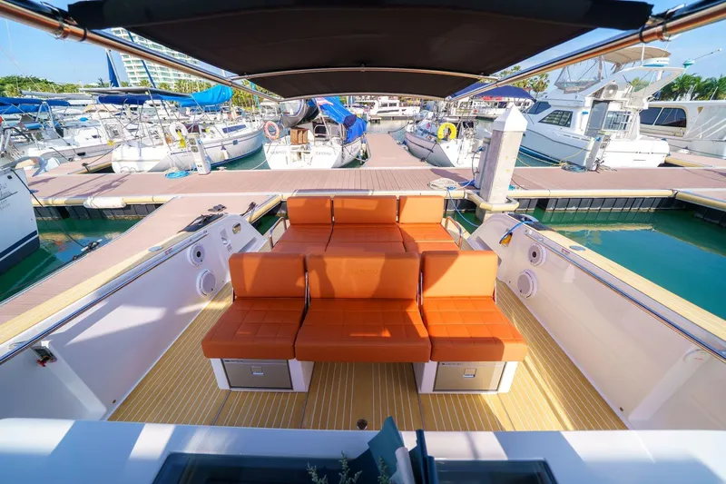 Pardo 38 Yacht Photos Pics 2025 Pardo Yachts P38 with orange seating, docked at a marina.
