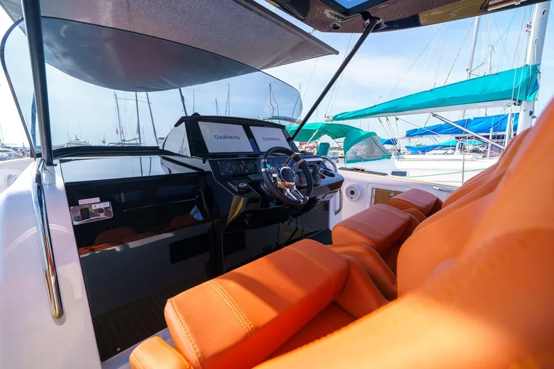 Pardo 38 Yacht Photos Pics 2025 Pardo Yachts P38 cockpit with orange seats and advanced navigation system.