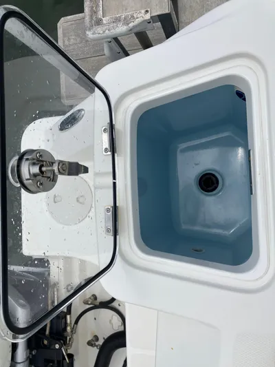 Yacht Photos Pics 2020 Boston Whaler 280 Outrage livewell with open lid, showcasing interior design.