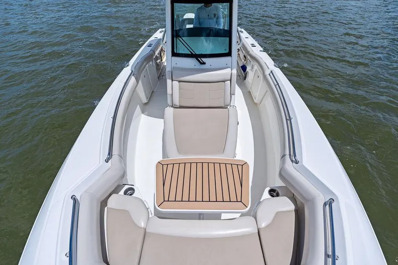  Yacht Photos Pics 2020 Boston Whaler 280 Outrage boat with spacious seating on open water.