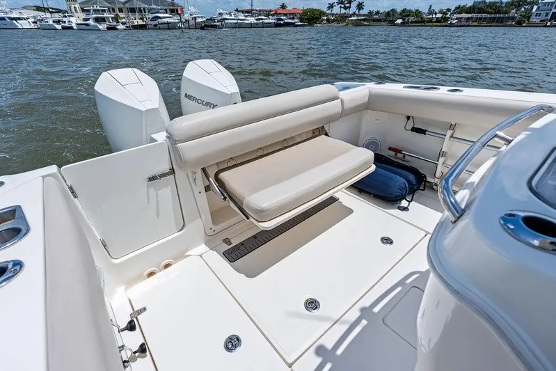  Yacht Photos Pics 2020 Boston Whaler 280 Outrage boat interior with seating and twin Mercury engines.
