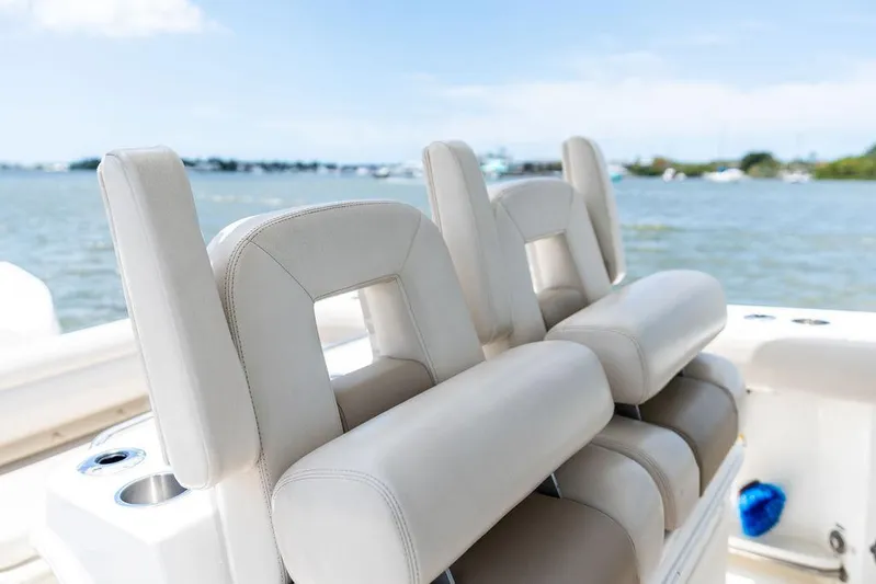  Yacht Photos Pics 2020 Boston Whaler 280 Outrage boat seats with ocean view in background.