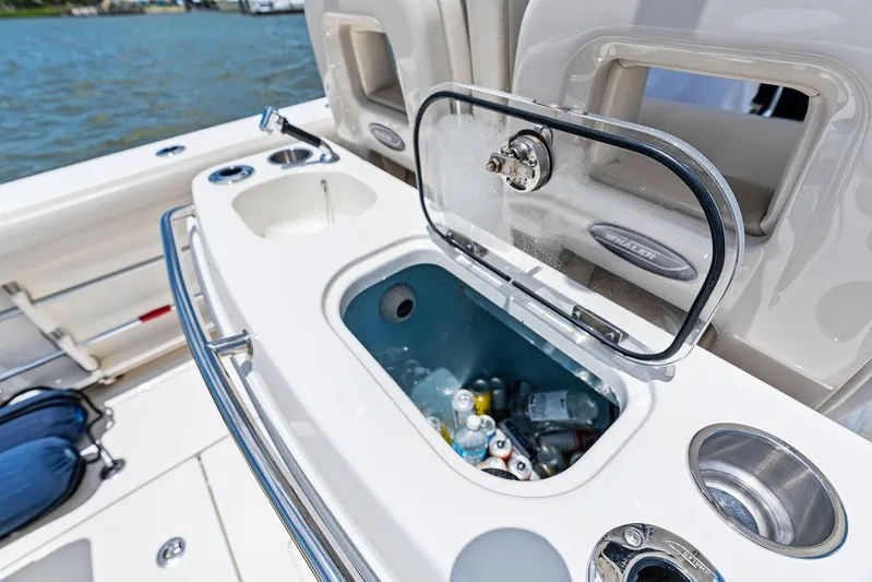  Yacht Photos Pics Boston Whaler 280 Outrage 2020 boat with open cooler and drink holders.
