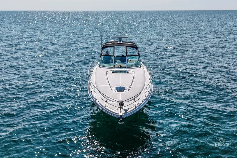  Yacht Photos Pics 2003 Sea Ray 420 Sundancer yacht cruising on open water under clear skies.