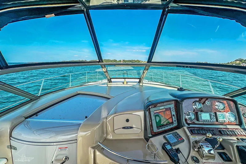  Yacht Photos Pics Helm view of 2003 Sea Ray 420 Sundancer yacht on open water.