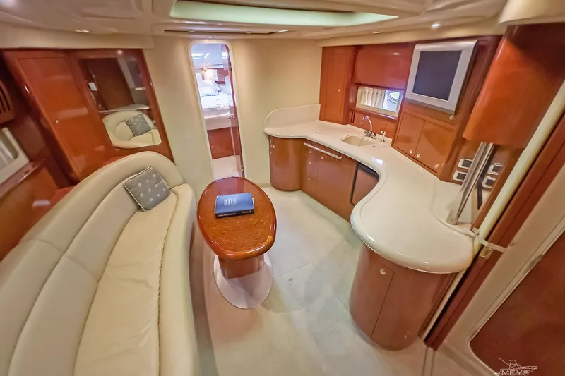  Yacht Photos Pics Luxurious interior of 2003 Sea Ray 420 Sundancer yacht with elegant seating and modern amenities.