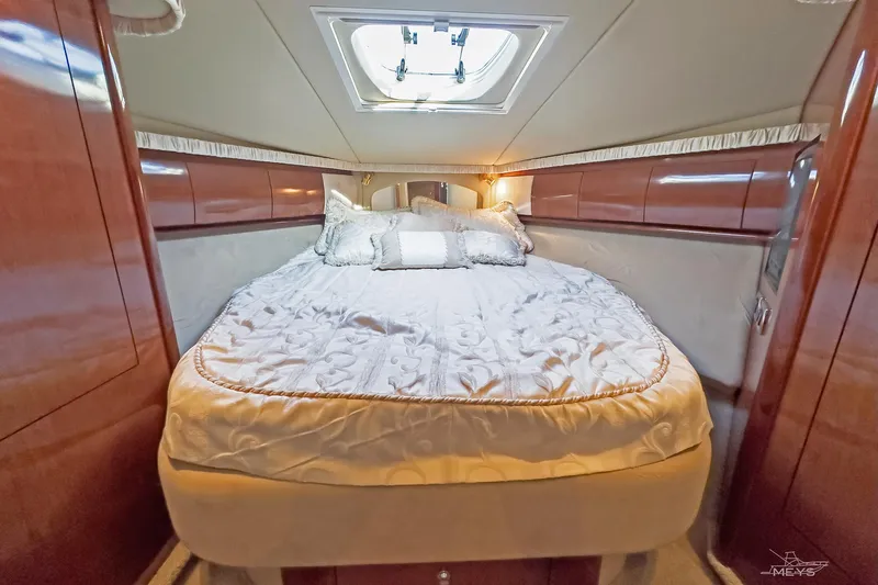  Yacht Photos Pics Luxurious cabin interior of 2003 Sea Ray 420 Sundancer yacht with elegant bedding.