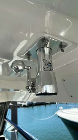  Yacht Photos Pics Close-up of a 2021 Boston Whaler 325 Conquest boat fitting with a marina background.