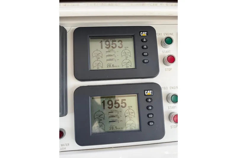 Wishlist Yacht Photos Pics Control panel of a 2009 Horizon 73 yacht with engine displays and start/stop buttons.