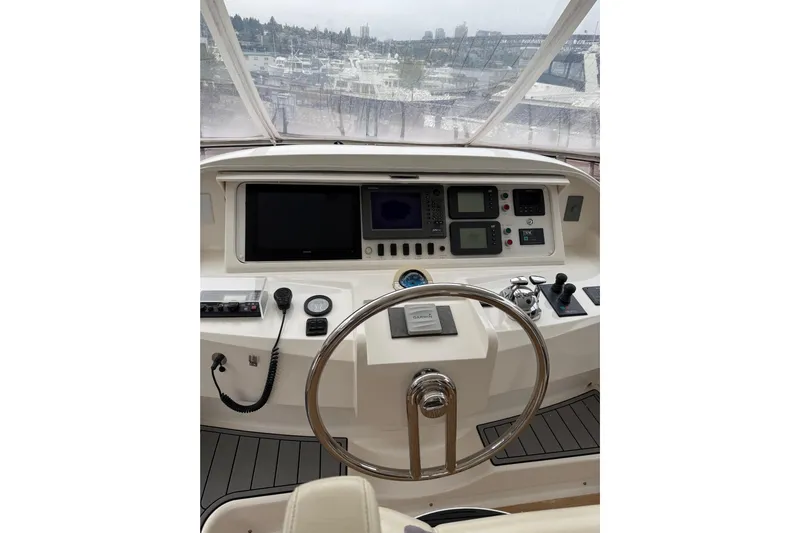 Wishlist Yacht Photos Pics Helm of 2009 Horizon 73 yacht with navigation controls and steering wheel.