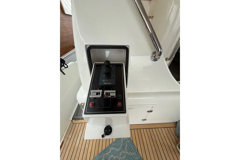 Wishlist Yacht Photos Pics Control panel on a 2009 Horizon 73 yacht, featuring joystick and switches.