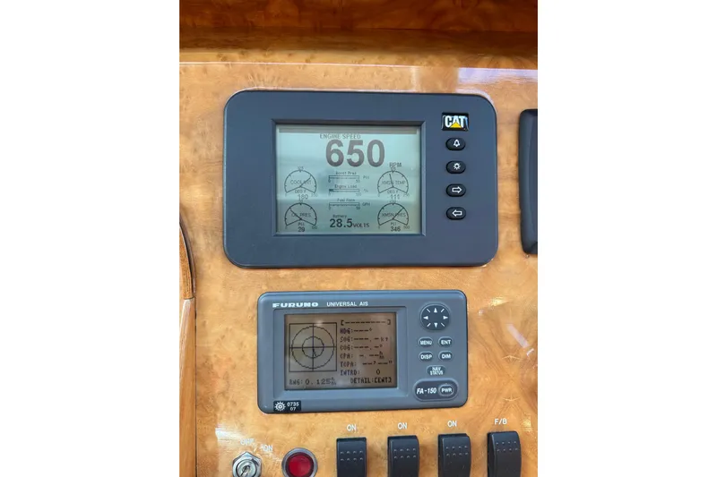 Wishlist Yacht Photos Pics Control panel of a 2009 Horizon 73 yacht with CAT and Furuno displays.