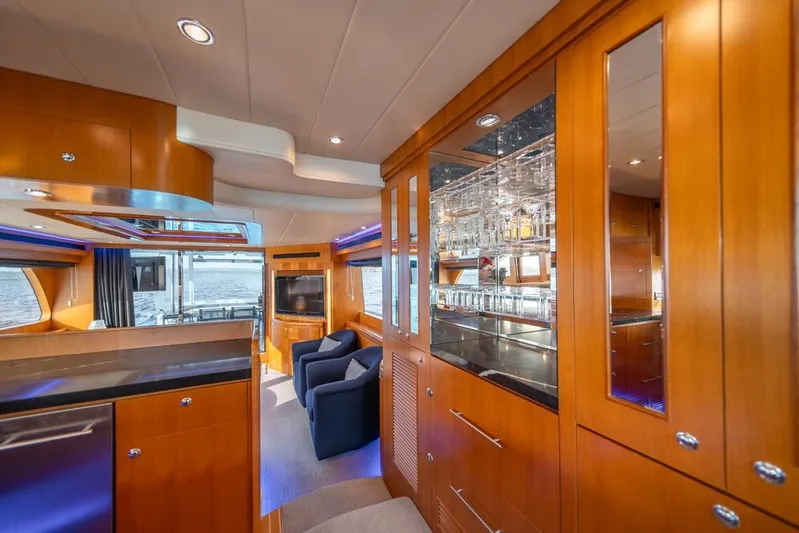 Wishlist Yacht Photos Pics Luxurious interior of 2009 Horizon 73 yacht with wooden cabinetry and modern amenities.