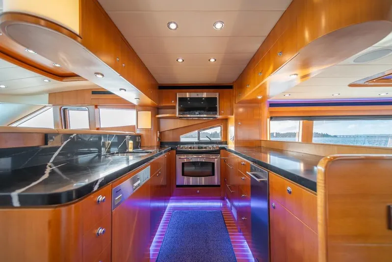 Wishlist Yacht Photos Pics Luxurious kitchen interior of 2009 Horizon 73 yacht with modern appliances and sleek design.