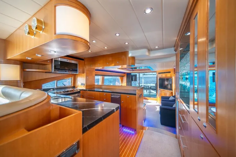 Wishlist Yacht Photos Pics Luxurious interior of 2009 Horizon 73 yacht with modern kitchen and seating area.
