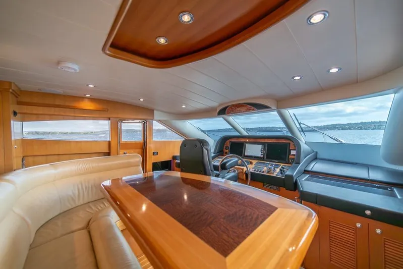 Wishlist Yacht Photos Pics Luxurious interior of 2009 Horizon 73 yacht with elegant wood finishes and panoramic windows.