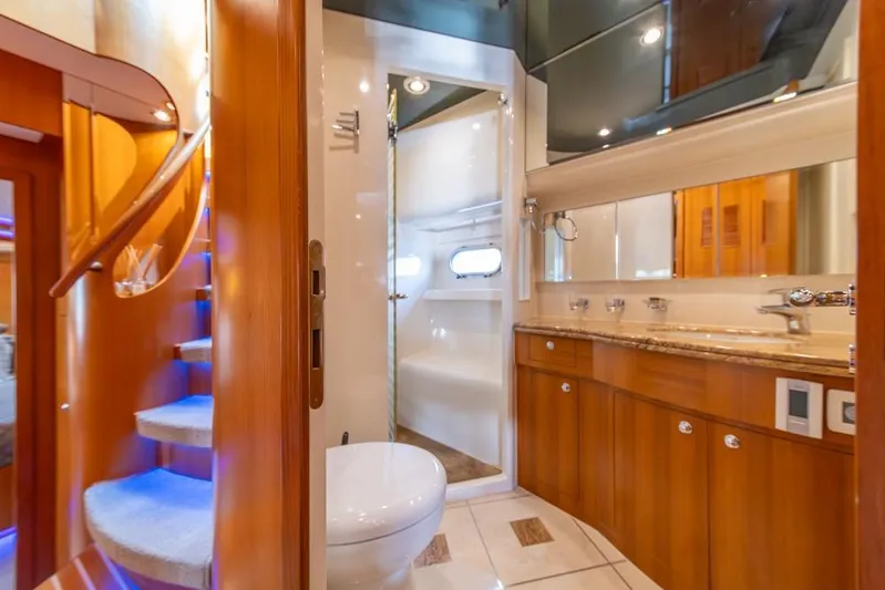 Wishlist Yacht Photos Pics Luxurious bathroom interior on 2009 Horizon 73 yacht with wooden cabinetry and modern fixtures.