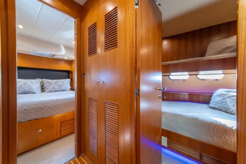 Wishlist Yacht Photos Pics Luxurious interior of 2009 Horizon 73 yacht with cozy bedrooms and wooden finishes.