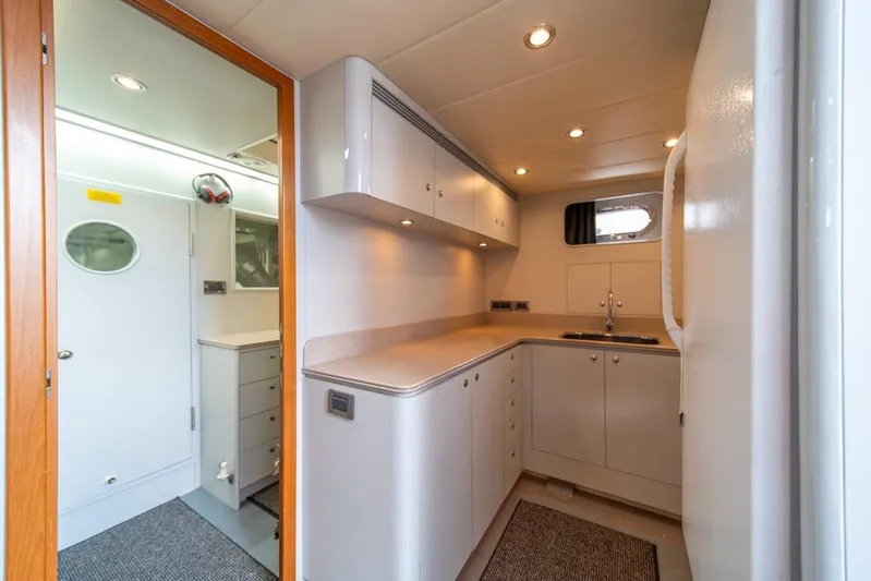 Wishlist Yacht Photos Pics Modern kitchen interior on 2009 Horizon 73 yacht, featuring sleek cabinetry and compact design.