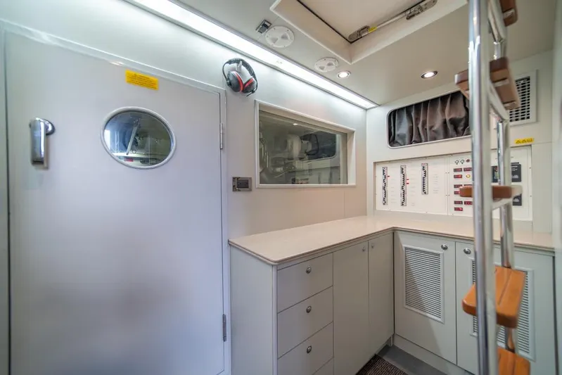 Wishlist Yacht Photos Pics Modern yacht interior with control panels, storage cabinets, and ladder, Horizon 73, 2009 model.