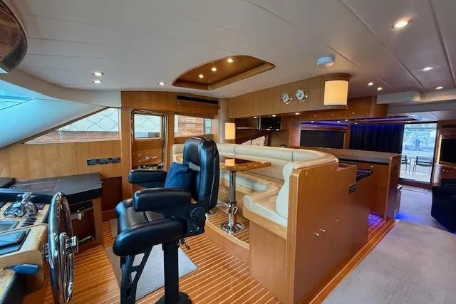 Wishlist Yacht Photos Pics Luxurious interior of a 2009 Horizon 73 yacht with modern helm and seating area.