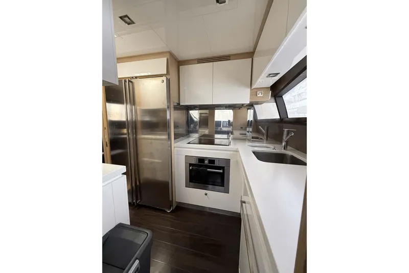  Yacht Photos Pics Modern kitchen interior of 2013 Ferretti Yachts 720, featuring sleek appliances and stylish design.
