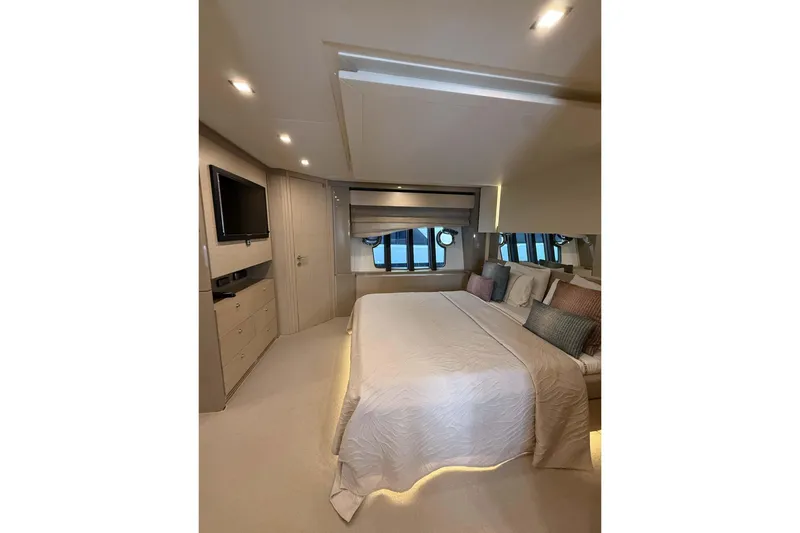  Yacht Photos Pics Luxurious bedroom interior of 2013 Ferretti Yachts 720, featuring elegant bedding and modern decor.