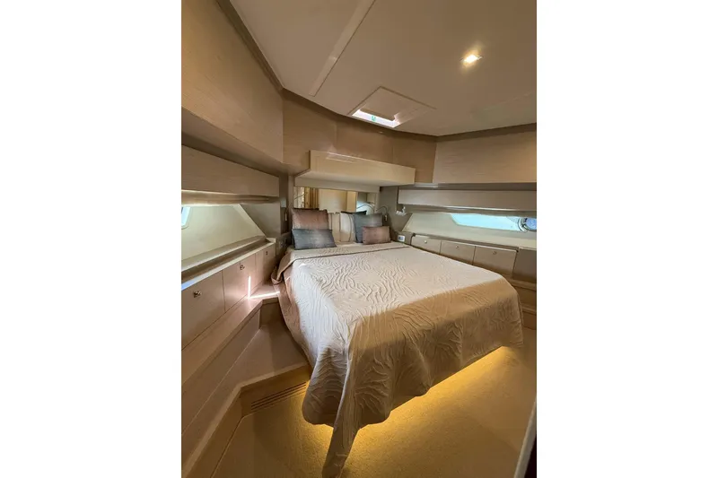  Yacht Photos Pics Luxurious bedroom interior of 2013 Ferretti Yachts 720 with elegant bedding and ambient lighting.