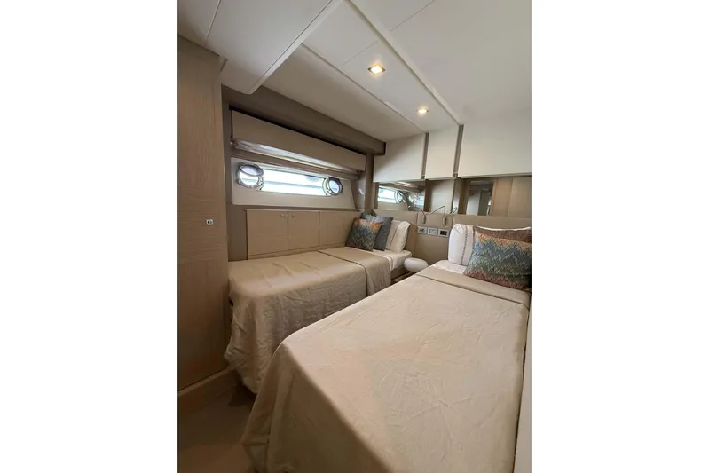  Yacht Photos Pics Luxurious twin bedroom in 2013 Ferretti Yachts 720, featuring elegant decor and natural light.