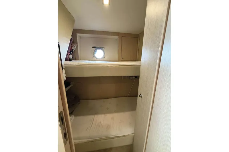  Yacht Photos Pics Bunk beds in 2013 Ferretti Yachts 720 cabin with porthole window.