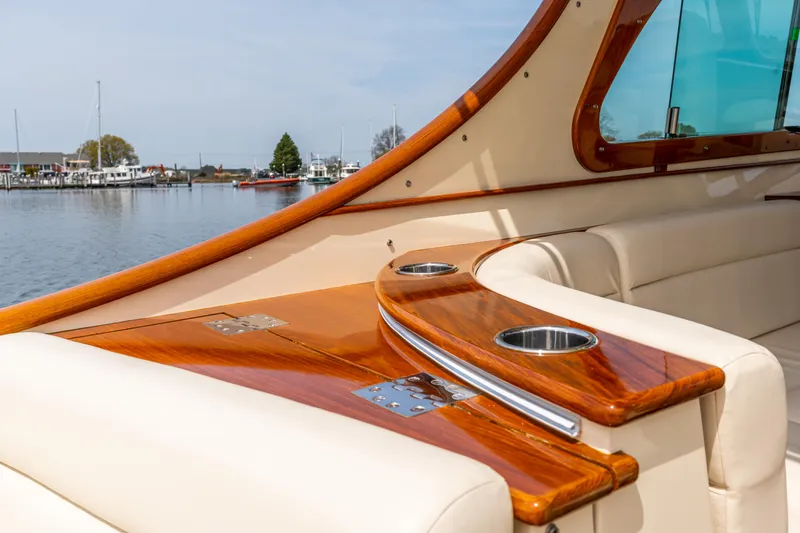 Just B Yacht Photos Pics Luxurious interior of 2018 Hinckley Picnic Boat MKII with polished wood and leather seating.