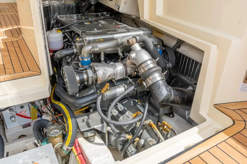 Just B Yacht Photos Pics Engine compartment of 2018 Hinckley Picnic Boat MKII, showcasing detailed mechanical components.